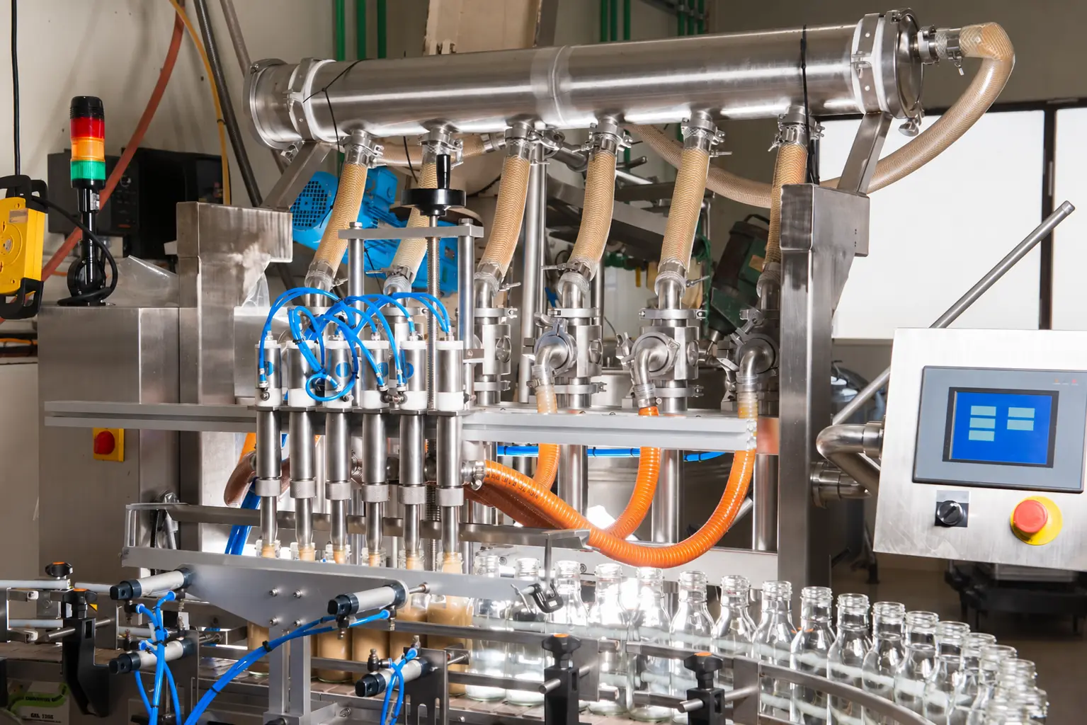 Anonymous six-head piston filling equipment at Just Perfect Specialty Foods